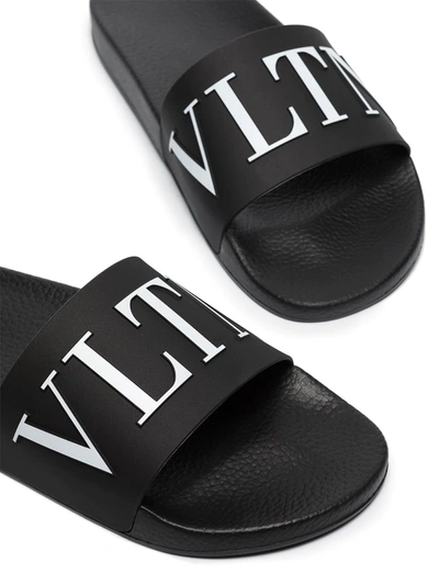 Shop Valentino Vltn-print Slides In Black