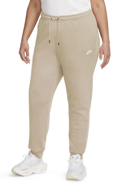 Shop Nike Sportswear Essential Fleece Pants In Rattan/ White
