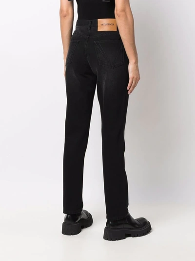 Shop Vetements Studded-logo Straight-leg Jeans In Black