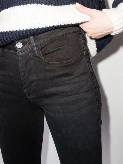 Shop Frame Low-rise Skinny Jeans In Black