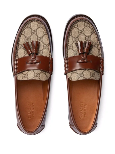 Shop Gucci Tassel-detail Gg Canvas Loafers In Braun