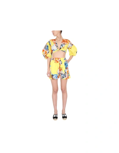 Shop Msgm Printed Shorts In Yellow