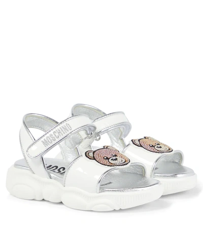 Shop Moschino Logo Leather Sandals In White Silver