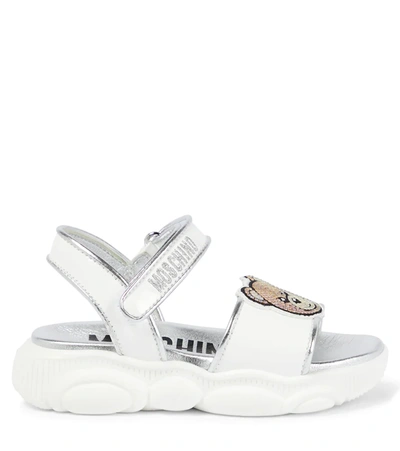 Shop Moschino Logo Leather Sandals In White Silver