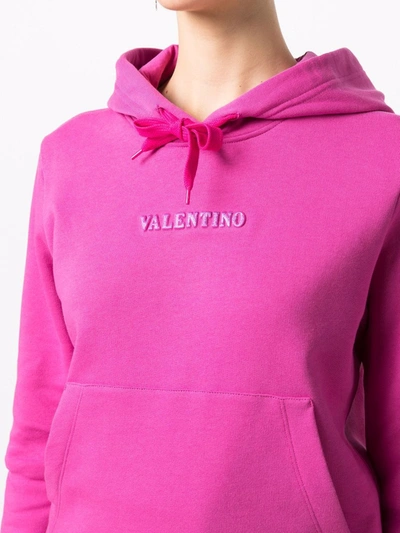 Shop Valentino Embossed Logo Hoodie In Pink