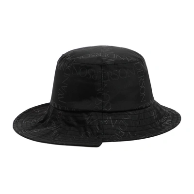 Shop Jw Anderson Asymmetric Logo Printed Bucket Hat In Black