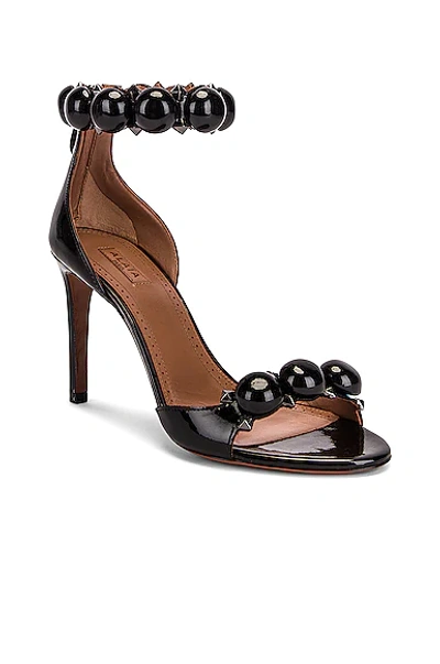 Shop Alaïa La Bombe Ankle Bracelet Sandals In Noir