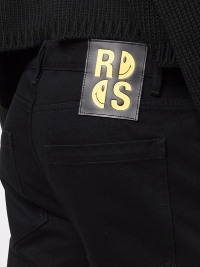 Shop Raf Simons Rear Logo-patch Jeans In Schwarz