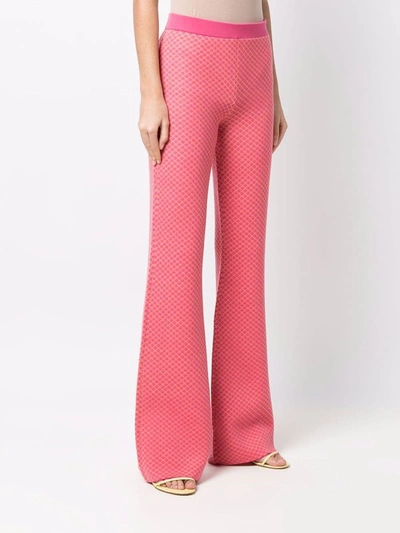 Shop Moschino Flared Jacquard-knit Trousers In Pink