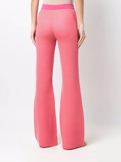 Shop Moschino Flared Jacquard-knit Trousers In Pink