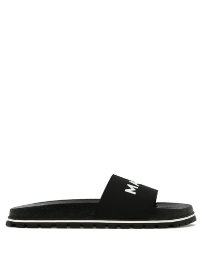 Shop Marc Jacobs Embossed Logo Sandals In Black  