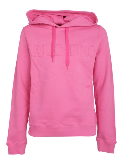 Shop Valentino Logo Embossed Drawstring Hoodie In Pink