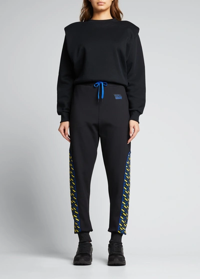 Shop Versace Greca Border Jogger Pants In Black Blue