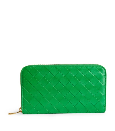 Shop Bottega Veneta Leather Intrecciato Zipped Wallet In Green