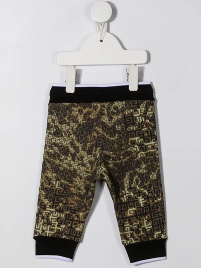 Shop Givenchy 4g Camouflage-print Trousers In Green