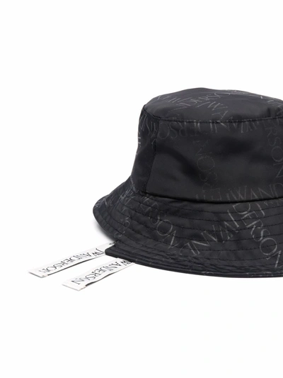 Shop Jw Anderson Asymmetric Logo-print Bucket Hat In Black