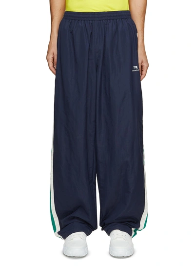 Shop Balenciaga Side Stripe Wide Legged Track Pants In Blue