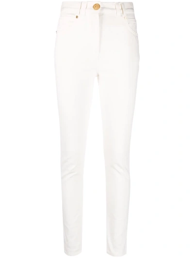 Shop Balmain Logo-buttons Skinny Jeans In Weiss