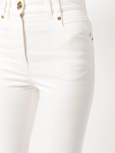 Shop Balmain Logo-buttons Skinny Jeans In Weiss