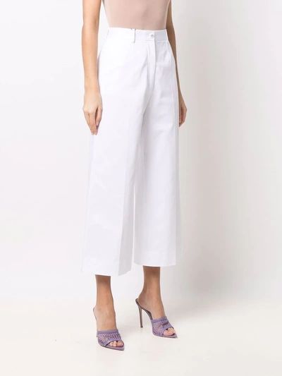 Shop Dolce & Gabbana Logo-buttons Wide Leg Cropped Trousers In Weiss