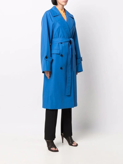 Shop Nina Ricci Double-breasted Belted Trench Coat In Blau