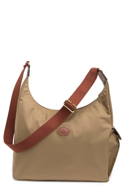 Shop Longchamp Le Pliage Side Pocket Hobo In Desert