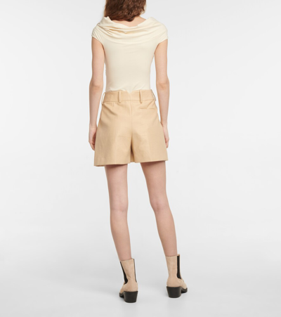 Shop Khaite Cerise Off-shoulder Bodysuit In Cream