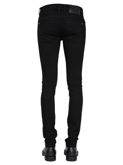 Shop Versace Skinny Fit Jeans In Black