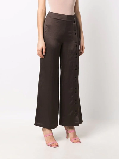 Shop Aeron Crest Button-cuff Palazzo Trousers In Brown