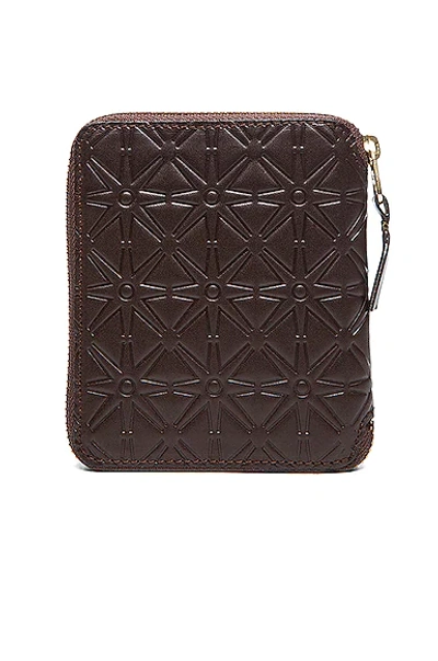 Shop Comme Des Garçons Star Embossed Zip Fold Wallet In Brown