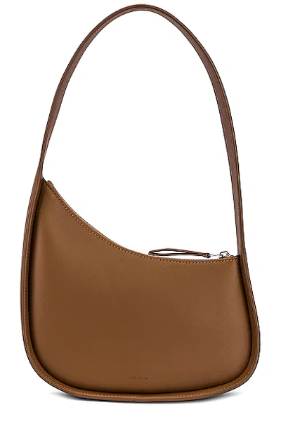 Shop The Row Leather Half Moon Bag In Chestnut