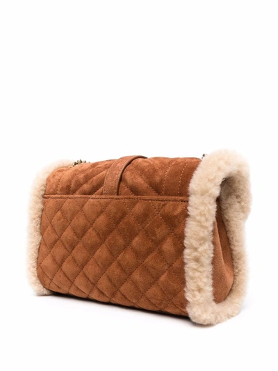 Shop Saint Laurent Envelope Shearling-trimmed Shoulder Bag In Brown