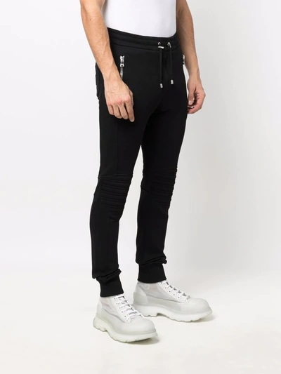 Shop Balmain Embossed Logo Track Pants In Schwarz