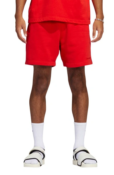 Shop Adidas Originals X Pharrell Williams Unisex Sweat Shorts In Vivid Red