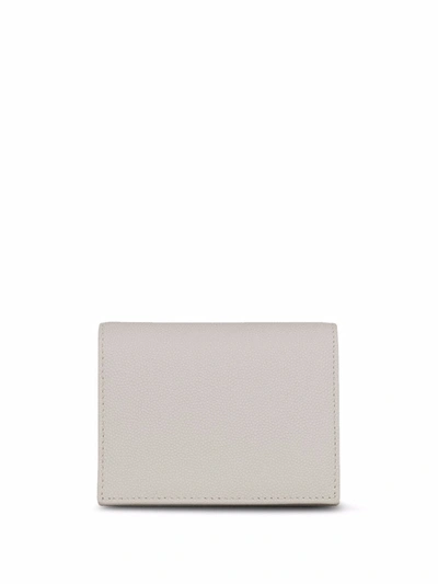 Shop Saint Laurent Monogram Foldover Wallet In White