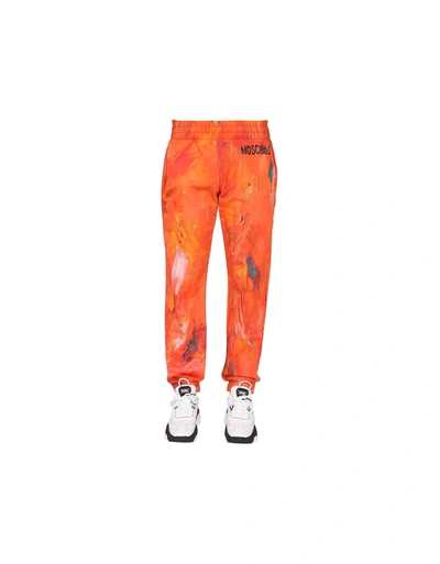Shop Moschino Painting Jogging Pants In Orange