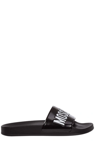 Shop Moschino Logo Embossed Pool Slides In Black