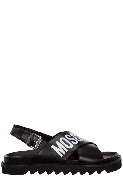 Shop Moschino Logo Printed Cross Sandals In Black