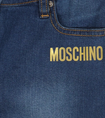 Shop Moschino Logo Printed Jeans In Denim Blue