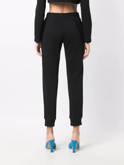 Shop Moschino Gem-embellished Track Pants In Black