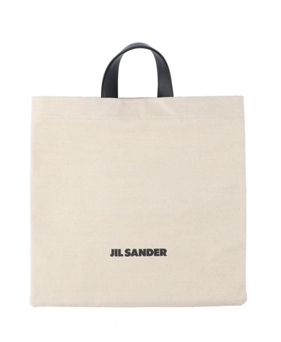Shop Jil Sander Logo Printed Top Handle Tote Bag In Beige
