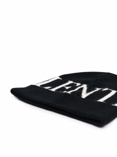 Shop Valentino Intarsia-logo Knitted Beanie In Black