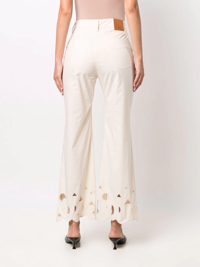 Shop Nanushka Embroidered Flared Trousers In Neutrals