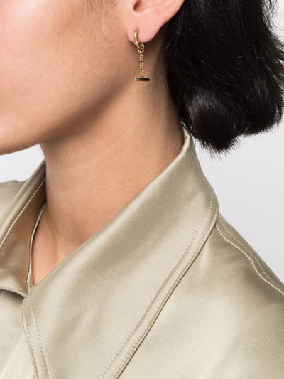Maria Black Spring Bar Huggie In Gold