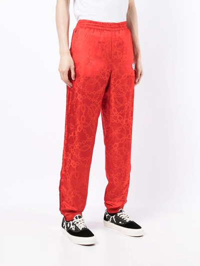 Shop Cool Tm Chainlink Print Track Pants In Red