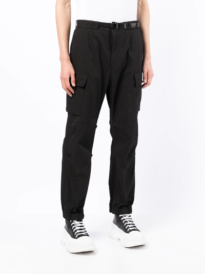 Shop Juunj Tapered-leg Cargo Trousers In Black