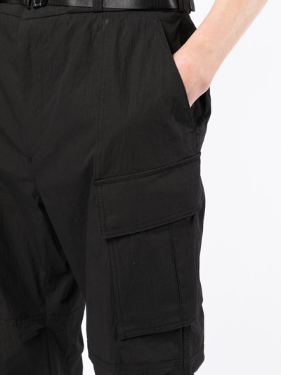Shop Juunj Tapered-leg Cargo Trousers In Black