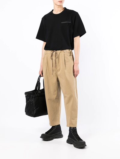 Shop Juunj Cropped Tapered-leg Trousers In Brown