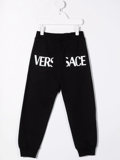 Shop Versace Greca-print Cotton Track Pants In Black