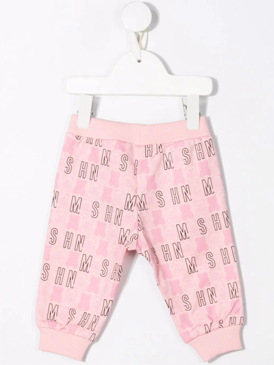 Shop Moschino All-over Logo-print Trousers In Pink